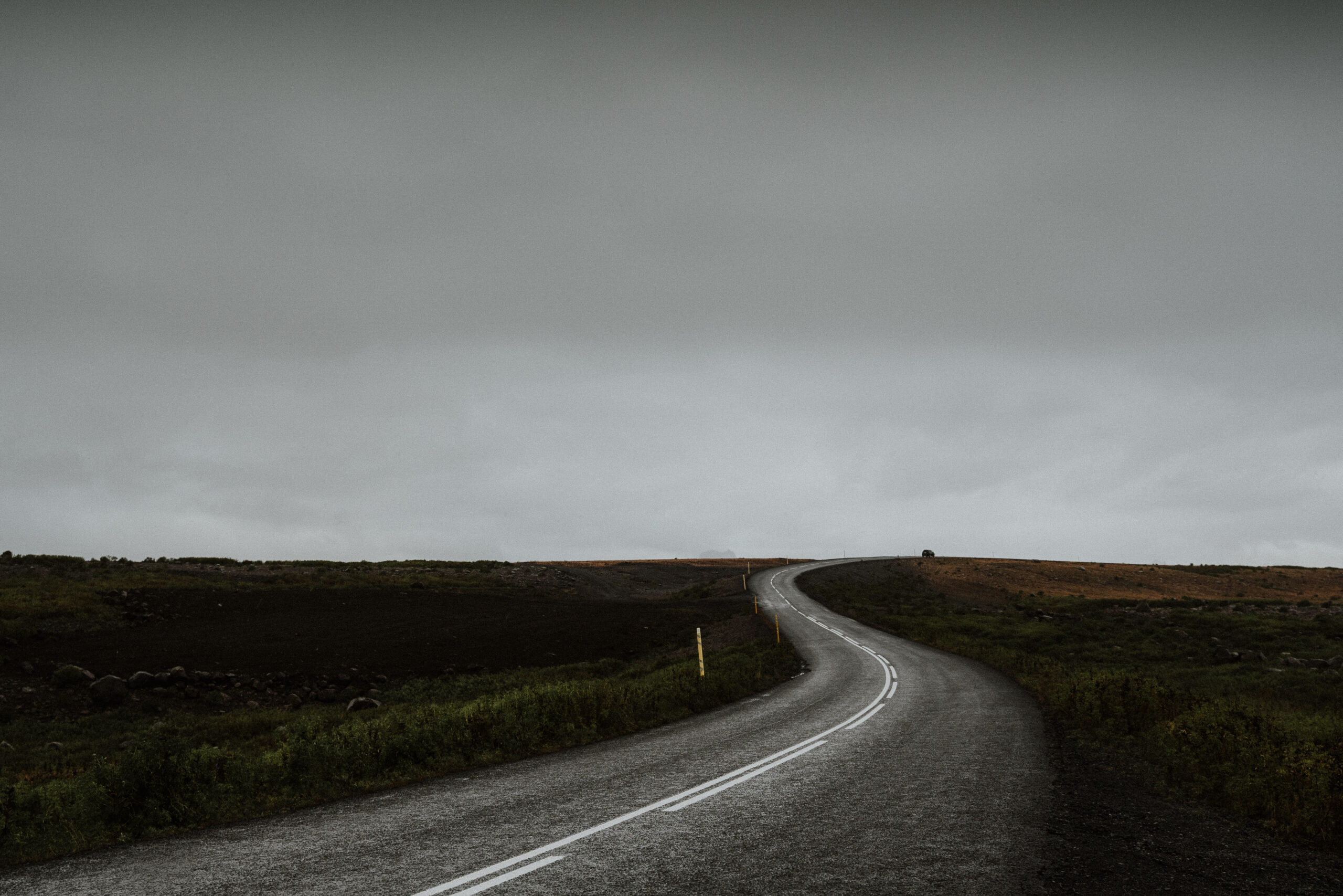 long-curvy-road-middle-green-field-iceland
