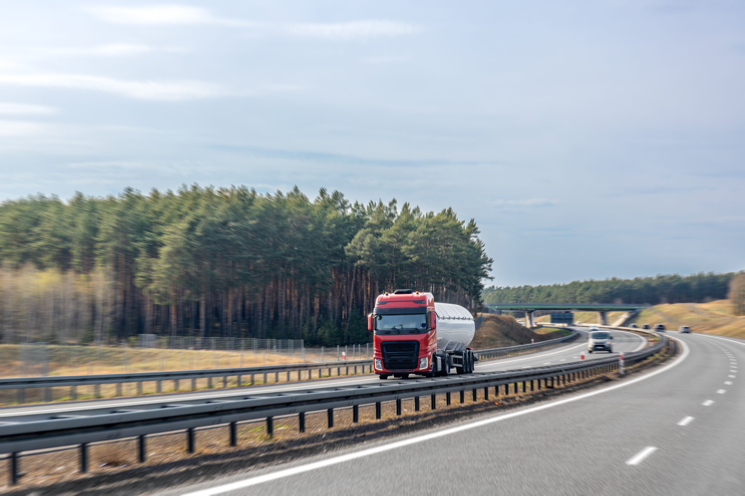 red-tank-truck-driving-highway-large-fuel-tanker-moves-along-road