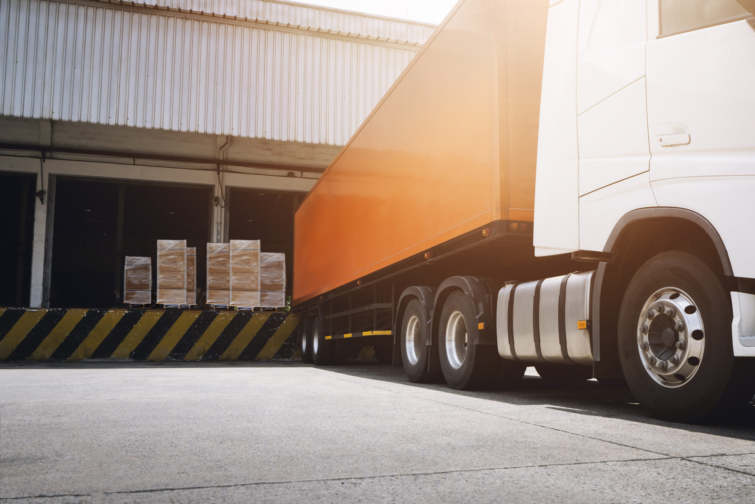 semi-trailer-truck-with-cargo-container-loading-dock-warehouse-packaging-boxes-shipment-transport