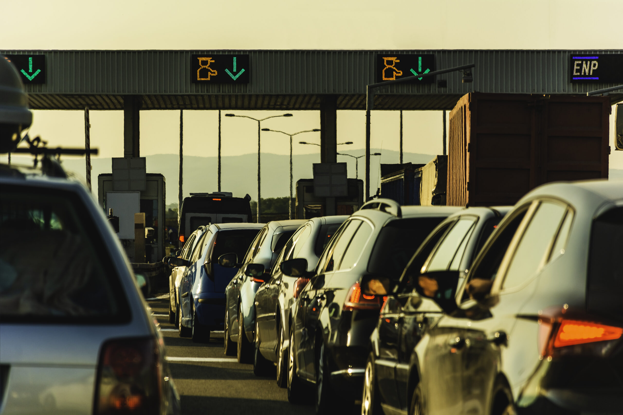 Cars waiting at highway pay toll peage